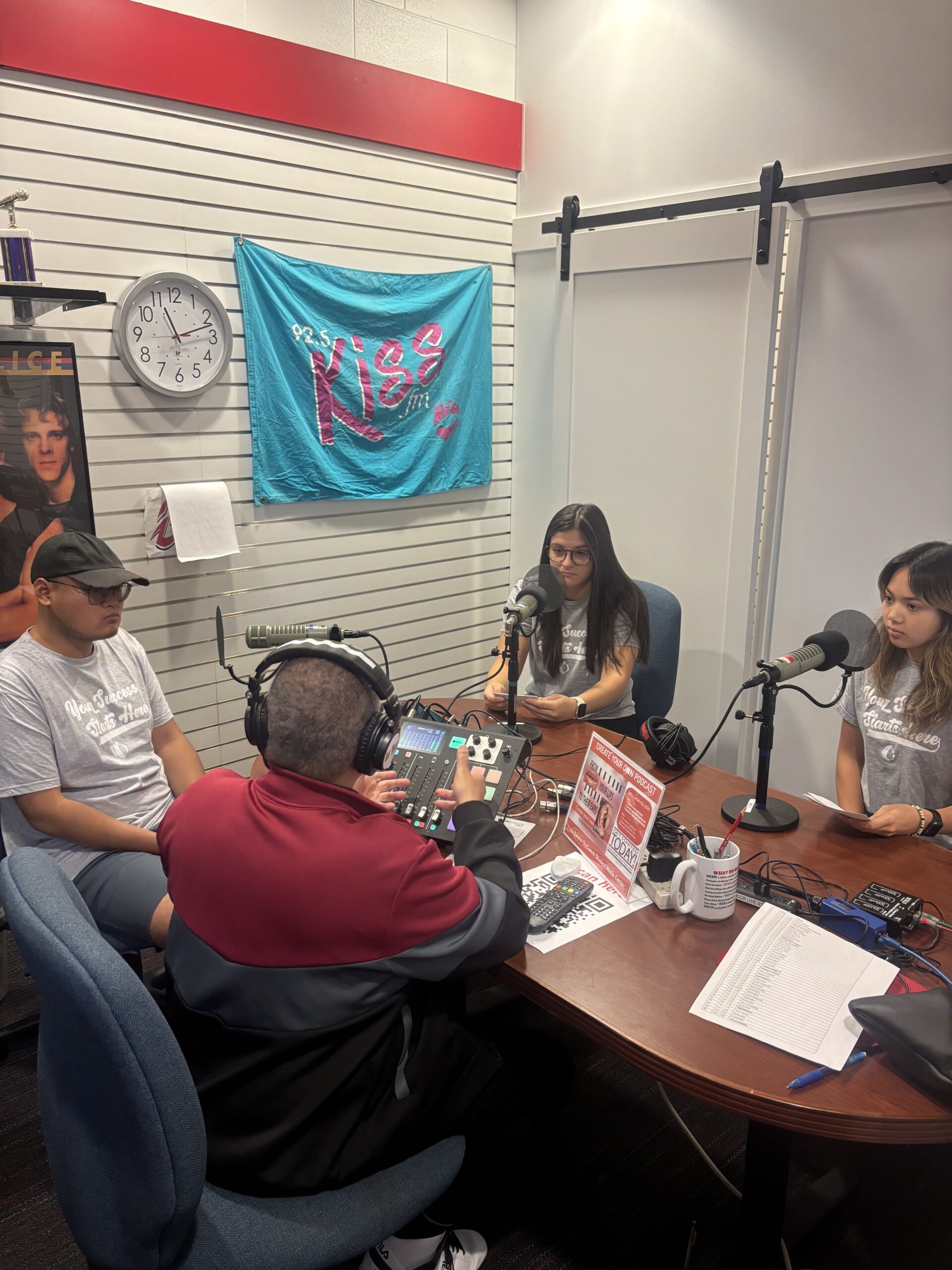 Owens marketing students recording a podcast in the Owens podcast room